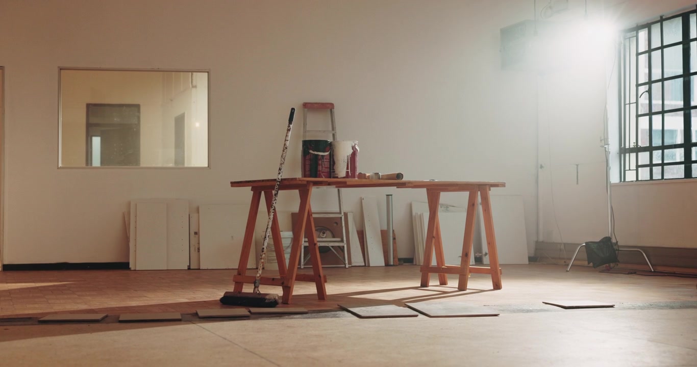 Wooden Workbench With Painting Supplies in Renovating Room