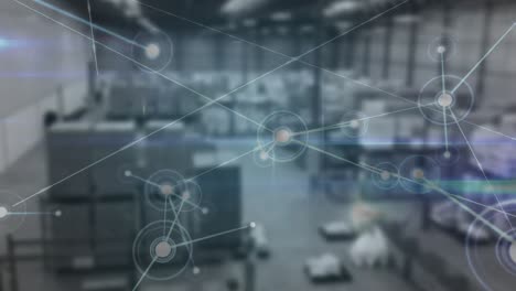 Animation-of-network-of-connections-over-blurred-warehouse