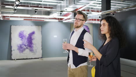 couple viewing art at an exhibition