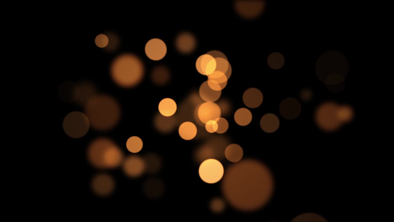 el fondo bokeh abstracto de oro naranja brillante. reflexiones circulares para navidad, año nuevo, vacaciones con fondo bokeh borroso.