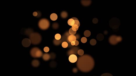 el fondo bokeh abstracto de oro naranja brillante. reflexiones circulares para navidad, año nuevo, vacaciones con fondo bokeh borroso.