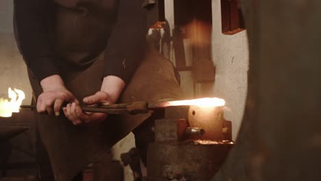 blacksmith automatic hammering the molten metal