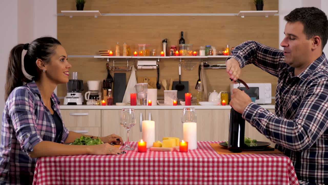 Couple enjoying romantic dinner at home