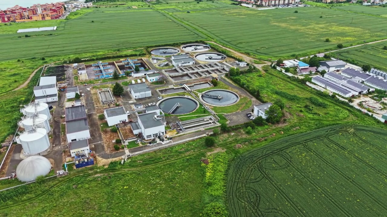 Renewable energy and agricultural integration at ecoconscious site. Ecofriendly water processing facility incorporating sustainable energy use and farm practices