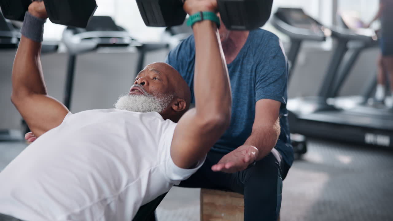 Senior Men Working Out with Dumbbells at the Gym