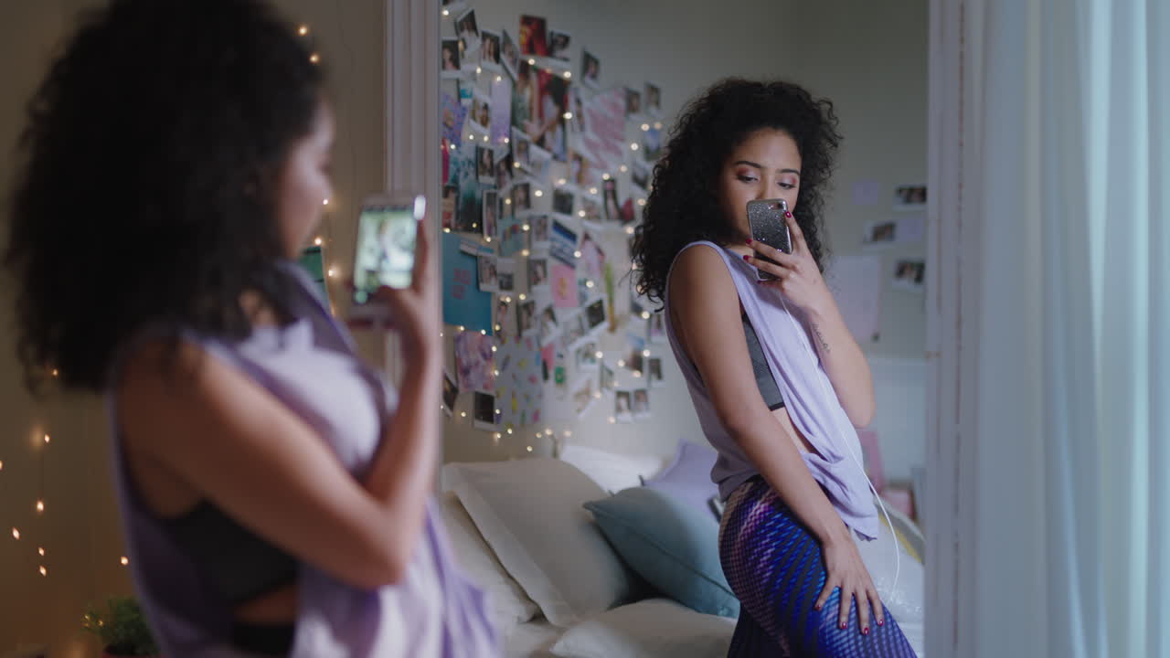 beautiful teenage girl taking selfie photo using smartphone posing in mirror sharing stylish fashion on social media enjoying weekend at home teen self image