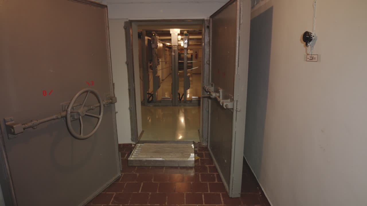 Chernobyl Bunker - Entrance To A Bunker Within The Chernobyl Nuclear Power Plant With Old Metal Door. - wide shot