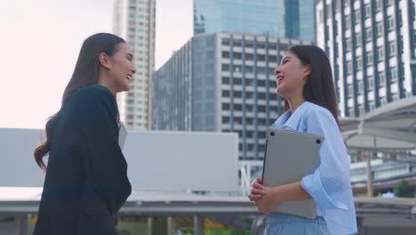 businesswomen meeting outdoors