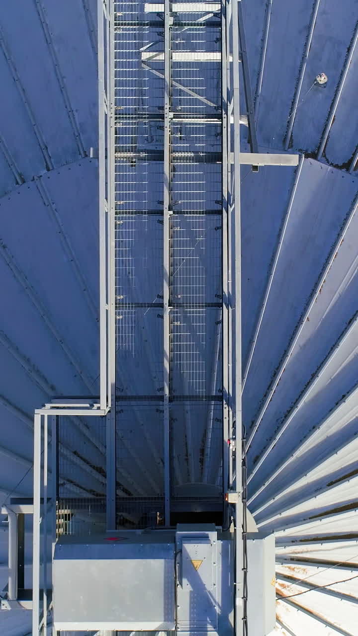 Grain drying complex construction. Grain elevator with metal containers for storing. Vertical video