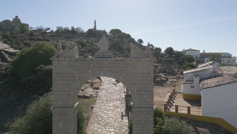 Stone-arch-entrance-gate-to-Our-Lady-of-Cabeza-sanctuary-holy-shrine-Spain-AERIAL