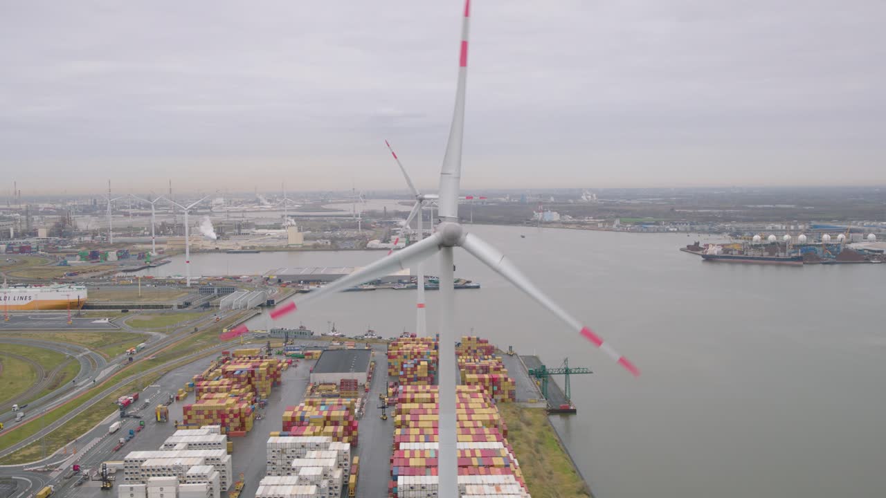 Wind turbines generate electricity in port of Belgium, aerial view