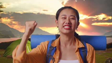 excited woman camper at sunrise