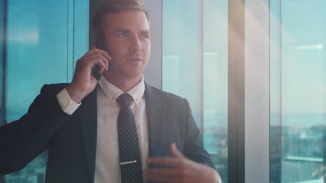 Window,-phone-call-and-corporate-businessman