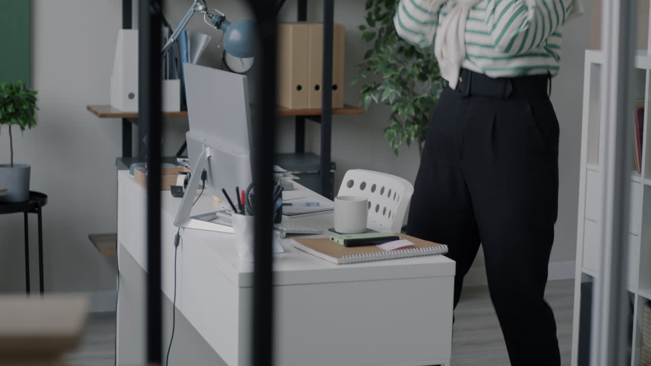 Woman Celebrating in a Modern Office