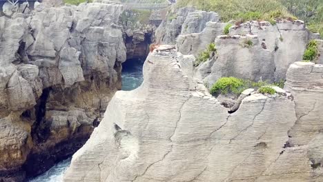 Drone-view-of-the-pancake-rocks-at-Dolomite-point,-Punakaiki,-New-Zealand