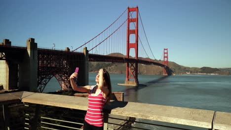 Woman-taking-selfie-with-Golden-Gate-Bridge