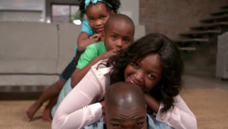 Family-posing-on-floor-for-camera