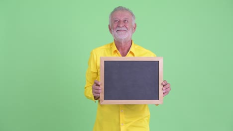 happy handsome senior bearded businessman