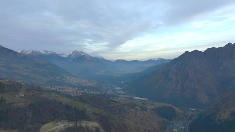 Beautiful-aerial-view-of-the-Seriana-valley-and-its-mountains-at-sunrise,-Orobie-Alps,-Bergamo,-Italy