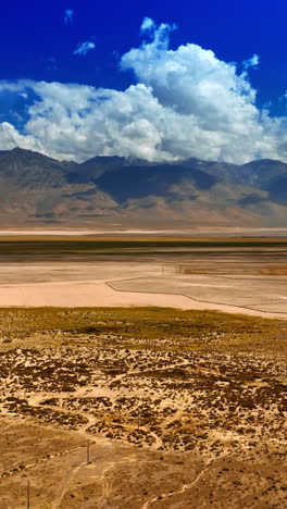 dry landscape with no greenery. scenery of death valley on sunny daytime from top. vertical video