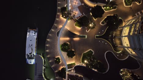 topdown aerial shot of brisbane city's eagle street pier boardwalk at night time