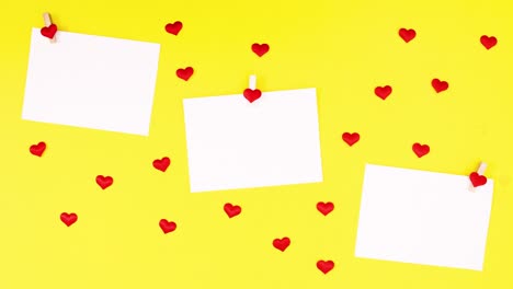 papers for text and hearts appear on yellow theme. valentine stop motion