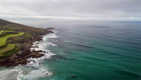 Tranquility-Scene-Of-Ocean-Waves-Gently-Splashing-On-Rocky-Shore-Of-Caion-On-A-Cloudy-Day-In-Coruña,-Spain