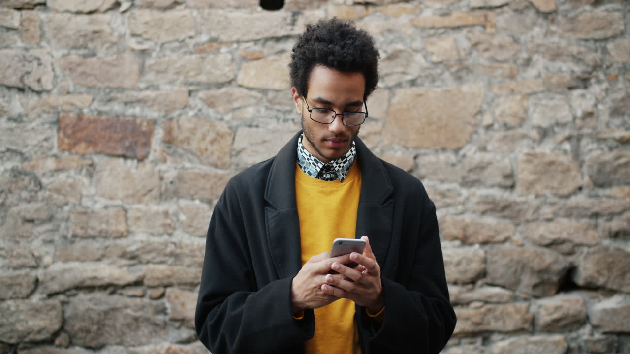 Man using smartphone outside