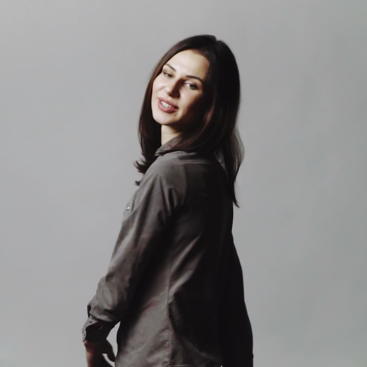Woman blowing confetti in studio