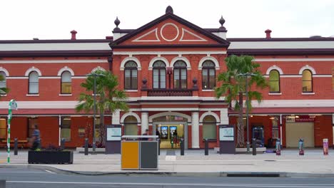 historic red brick train station in a city