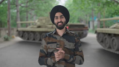 happy sikh indian army man doing namaste