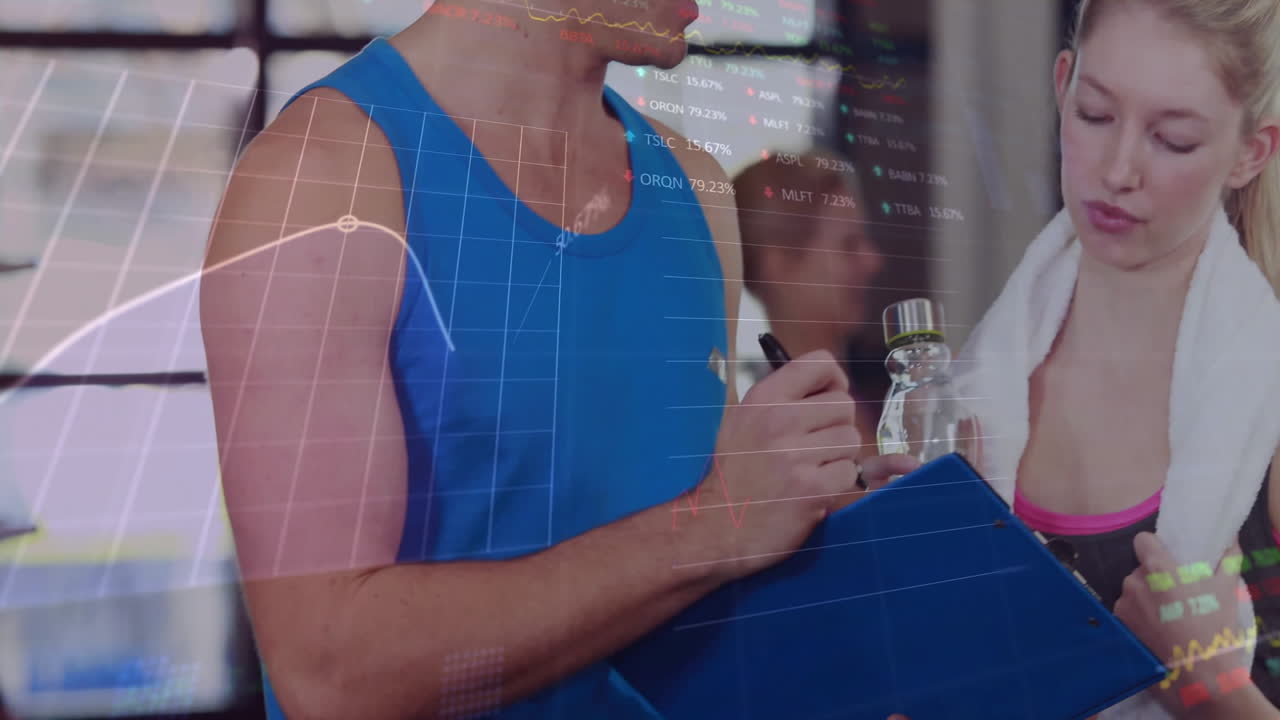 trainer and trainee consulting clipboard notes at gym, overlaying animated performance graphs