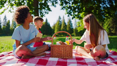 children enjoying a picnic in the park