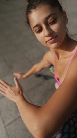 woman doing yoga stretches in sportswear