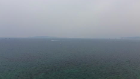 Aegean-sea-skyline-with-fog,-turquoise-calm-colour-water,-aerial-drone-view