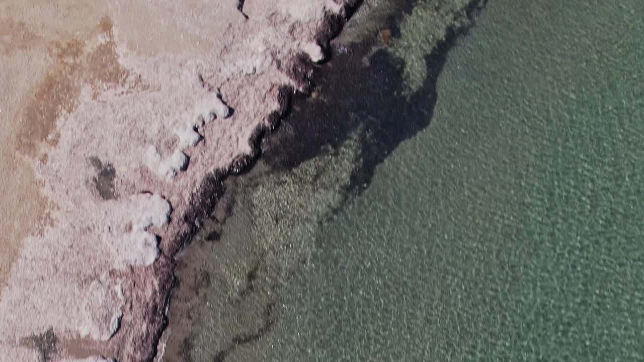 Clear water in Rhodes Greece shows the shoreline and sea bottom