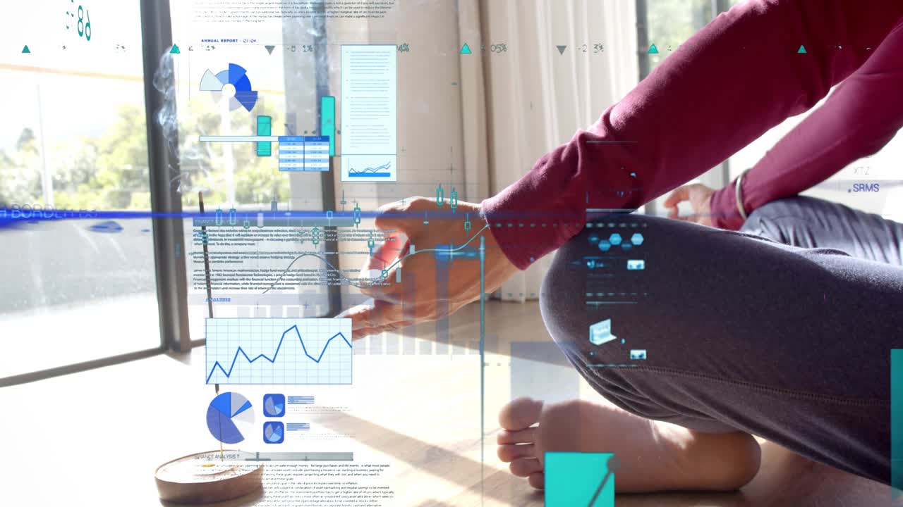Man sitting on floor, hand near incense smoke initiating AR charts responding to gestures for data