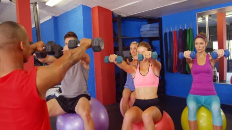 Group-of-people-exercising-with-dumbbell