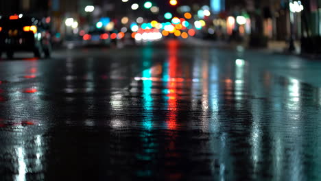 night reflections on a wet city street