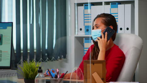 freelancer working and talking on phone