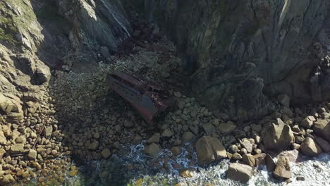 flyover shipwreck of rms mulheim cargo ship at land's end united kingdom - aerial shot