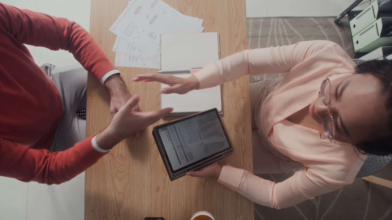 Product Manager Greeting Employee at Office Table