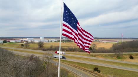 trucks drive america. big rigs on interstate 80 near the flags of freedom at princeton illinois.