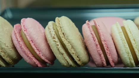 a batch of macaroons on a plate closeup tracking shot