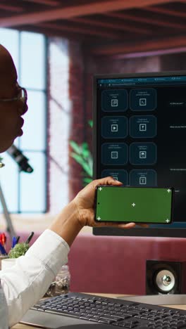 vertical video woman at desk using mockup phone to follow tutorial on ai llm program