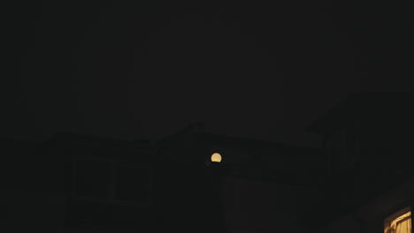 timlapse sky is dark big light bulb on roof in berlin friedrichshain