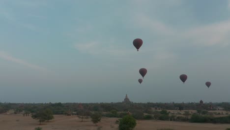 Tourist-attraction-in-Myanmar,-hot-air-balloon-ride-above-Bagan-Temples