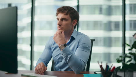 exhausted worker worrying business process sitting desk corporate office closeup