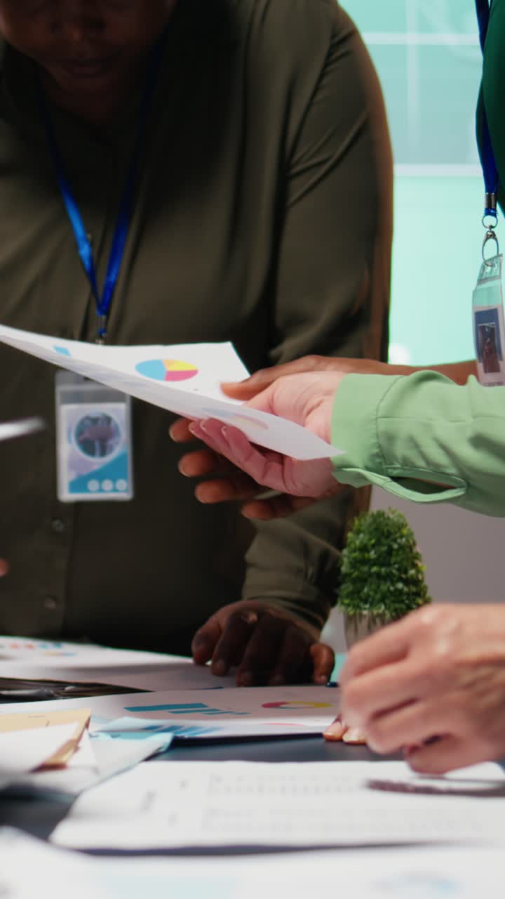 Vertical Video Business colleagues attending in a late night briefing session for teamwork