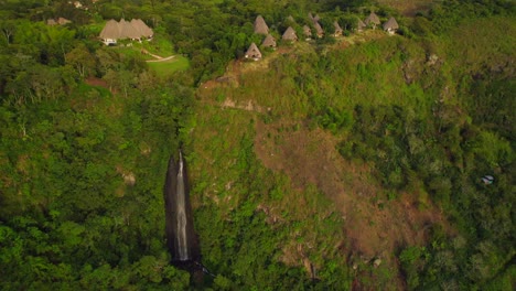 Waterfall-flowing-from-Masaya-tropical-hotel-in-the-colombian-jungle-at-sunrise